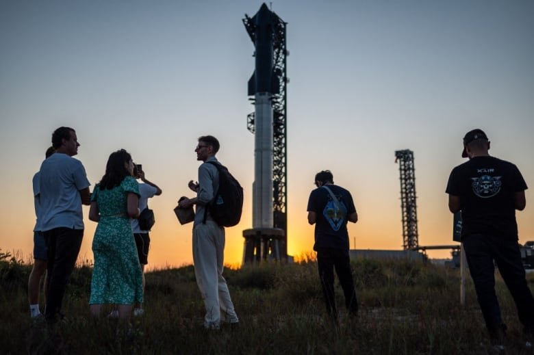 2177456428 The SpaceX Starship as sits on a launch pad.