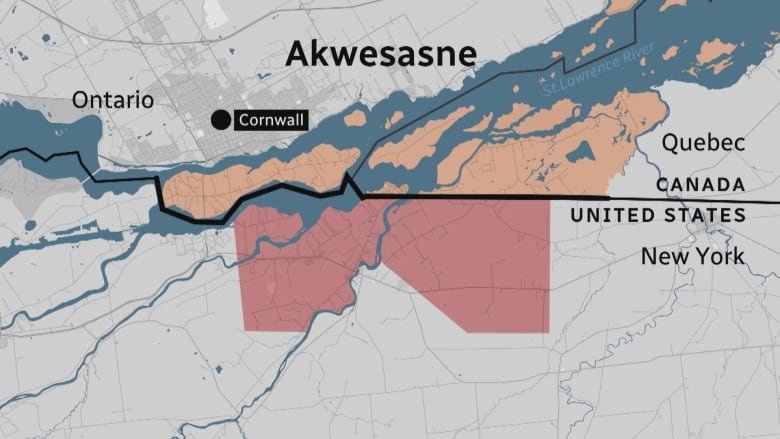 A map shows how the Akwesasne territory is divided by the St. Lawrence River and the Canada-U.S. border.