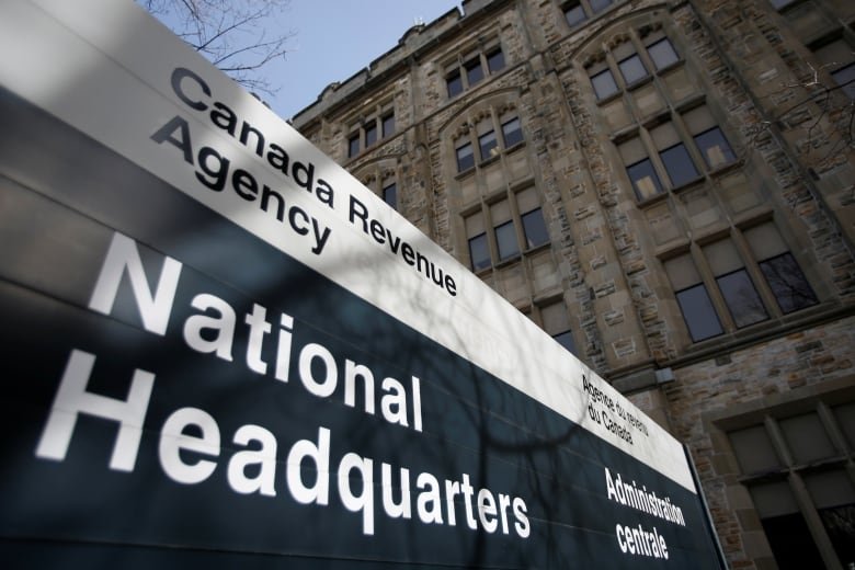canada-revenue-agency A sign saying 'Canada Revenue Agency' is seen outside a large stone building.