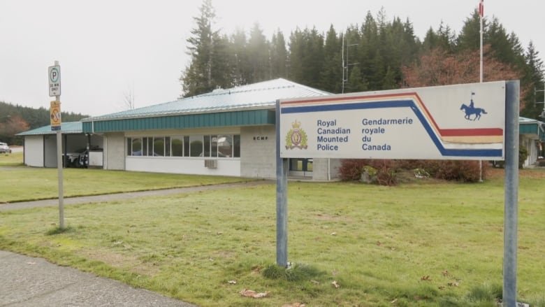 rcmp-gold-river An exterior photo of a small office with a rectangular sign on the lawn that says Royal Canadian Mountain Police in both languages.