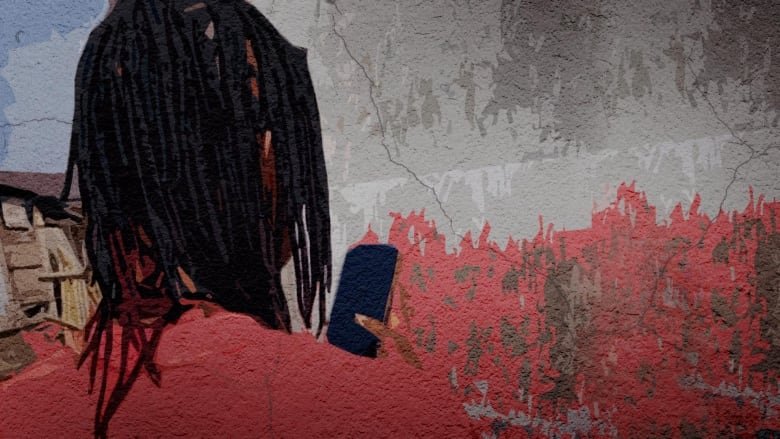 romance-scammer A Black man with thin dreadlocks and a red shirt is standing with the back of his head to the camera. He's looking at a phone in his right hand that has a black screen.