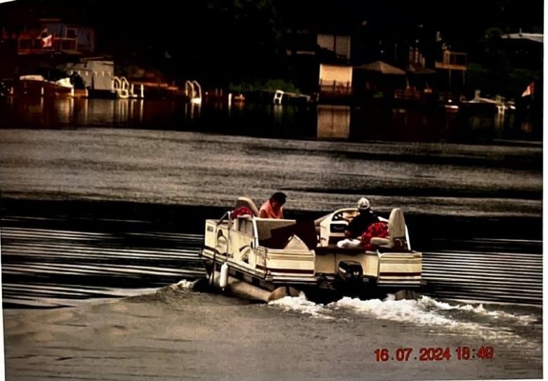 A photo of a boat with two women.