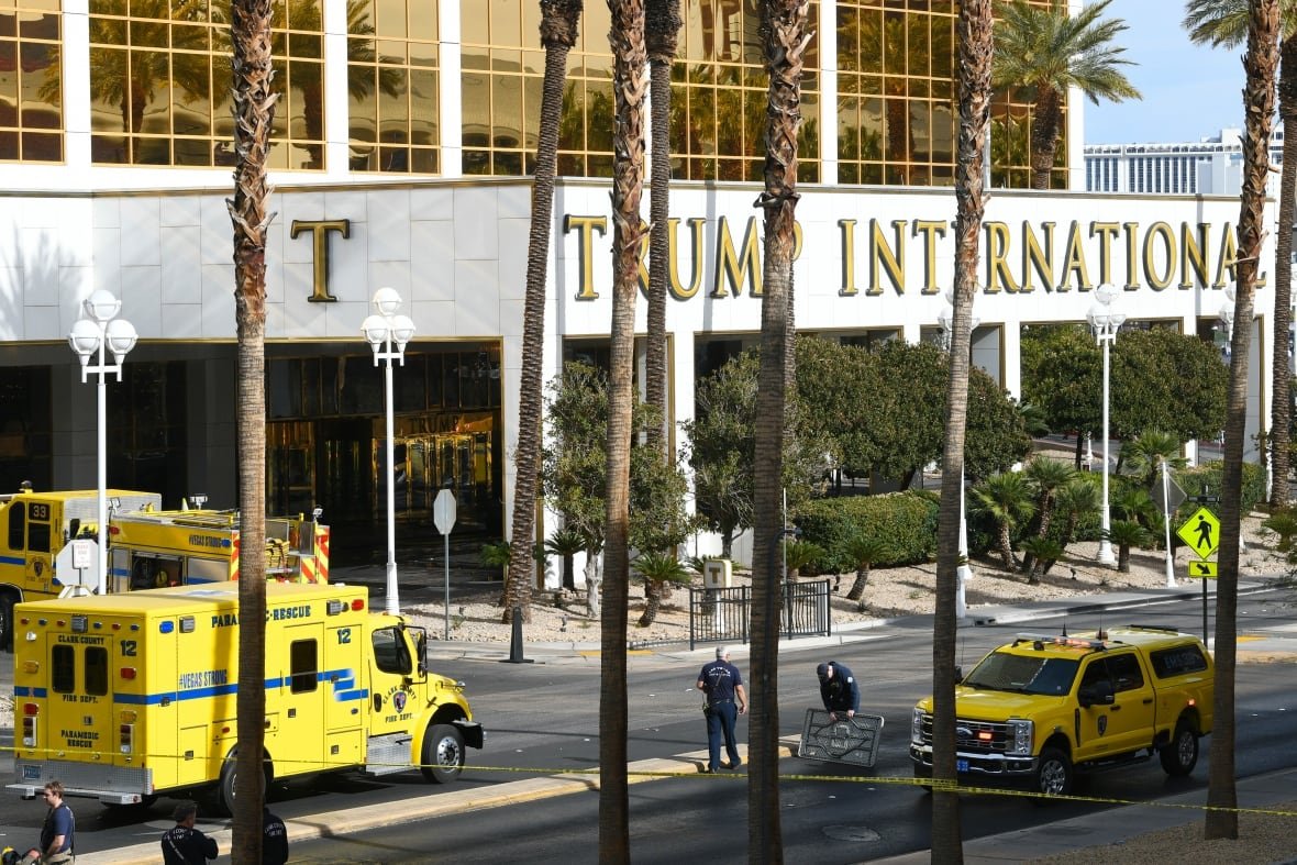 trump-hotel-fire-las-vegas Officials work behind police tape.