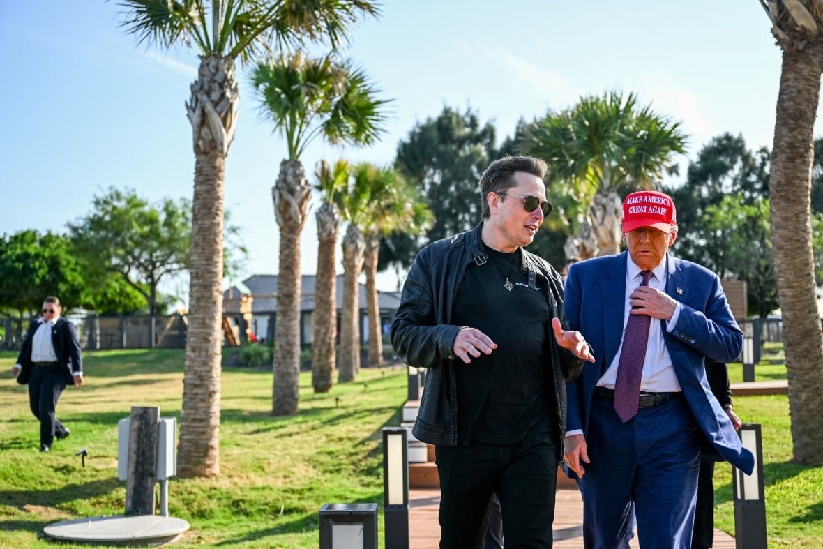 FILE PHOTO: Elon Musk greets U.S. President-elect Donald Trump as he arrives to attend a viewing of the launch of the sixth test flight of the SpaceX Starship rocket in Brownsville, Texas, U.S., November 19, 2024.