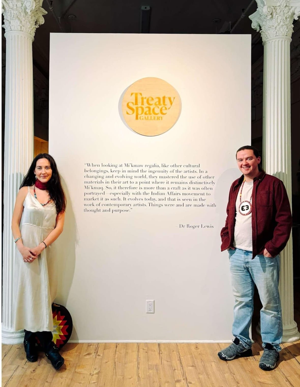 aaron-prosper-mackenzie-pardy A woman and a man stand in front of a sign that says Treaty Space.