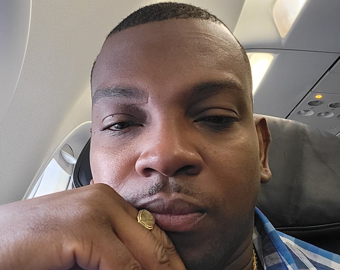 garth-jackson Selfie of man seated on plane.