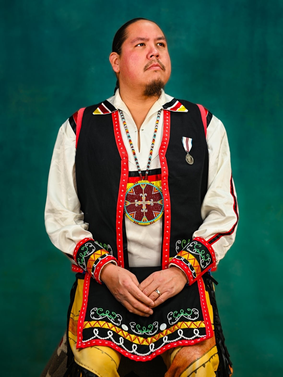 michael-r-denny-kojua-regalia-gallery A man in Kojua dance regalia poses for a portrait.