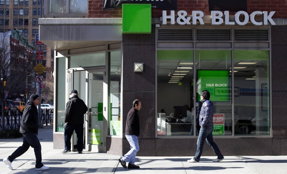 h-and-r-block Pedestrians walk past an H&R Block store in New York