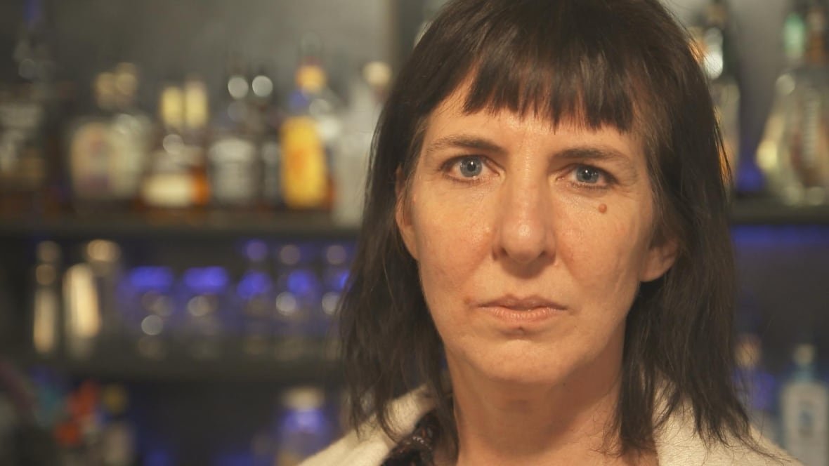 heidi-germann-fraud-victim A woman with dark hair looks into the camera