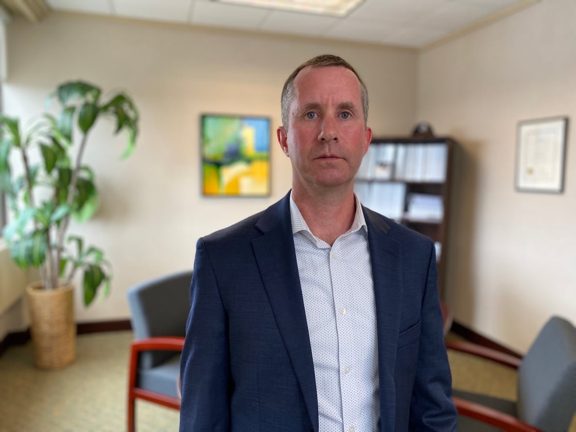 jason-roberts Man in suit in office