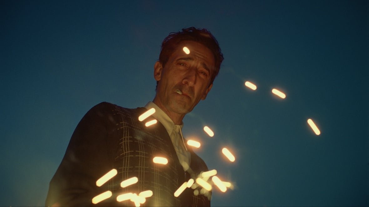 the-brutalist Adrien Brody smoking a cigarette in the film, The Brutalist.