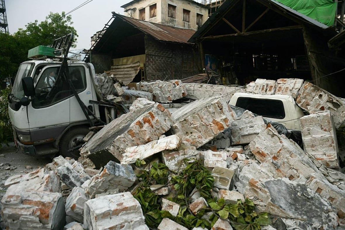 2207003342 Blocks of concrete cover two vehicles.