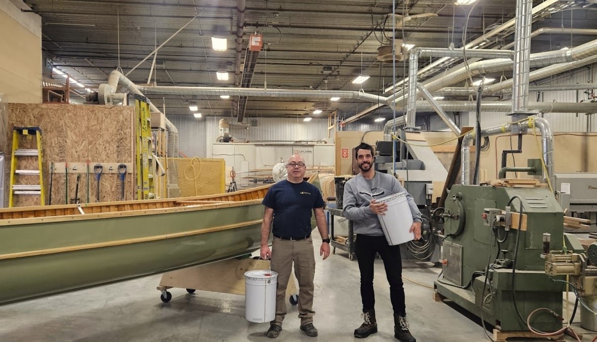 bruno-forest-and-tremblay Two men crafting a cedar canoe.
