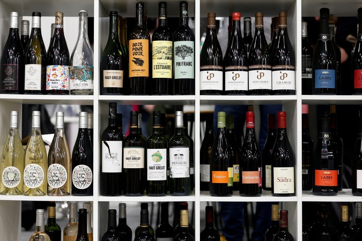 france-wine Bottles of wine are displayed in a rack during the Wine Paris trade fair in Paris, France, European alcohol exports to the United States account for more than $14 billion dollars annually. February 12, 2025.