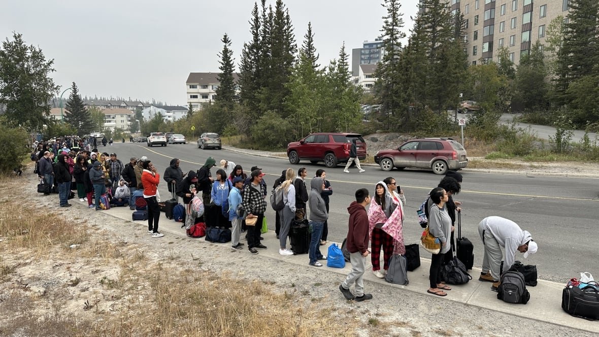 line-up-on-49th-street-yellowknife A line up of people on the street.