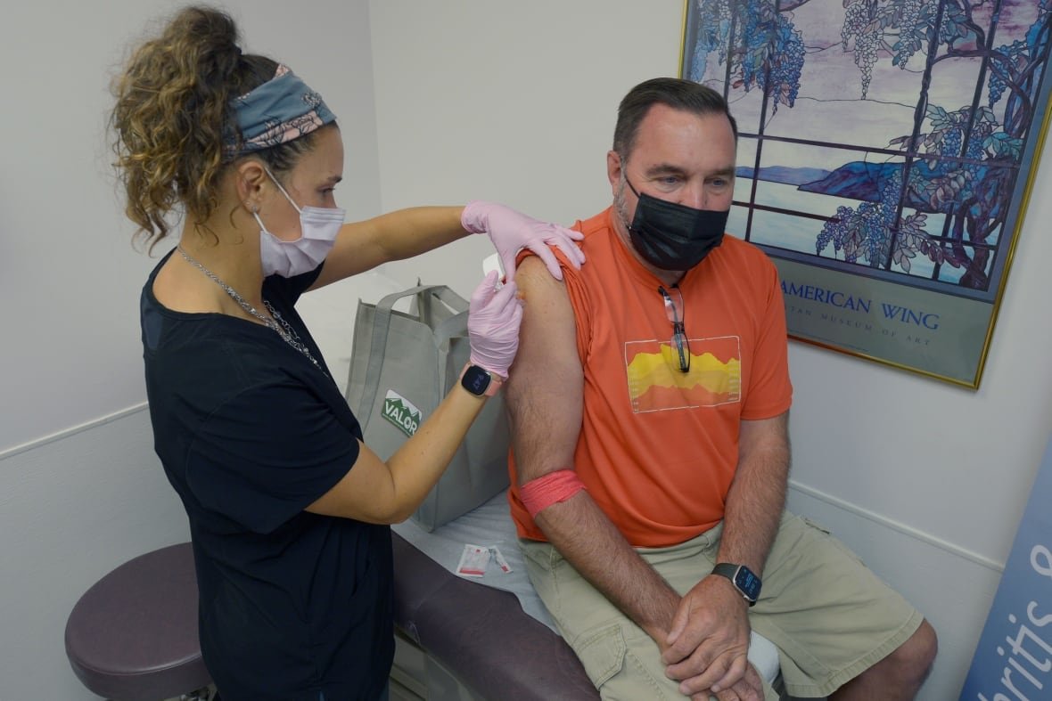 lyme-vaccine A man receives an injection from a nurse.