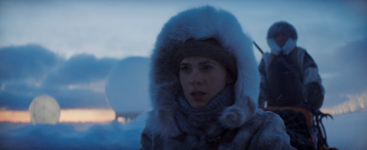 mission-impossible-the-final-reckoning-2 A woman wearing a fur hood outside with a another woman in the background