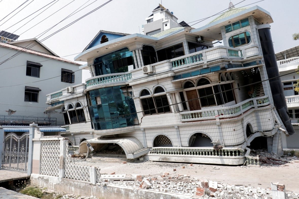 myanmar-quake-1 A building, fully intact but leaning forward after an earthquake.