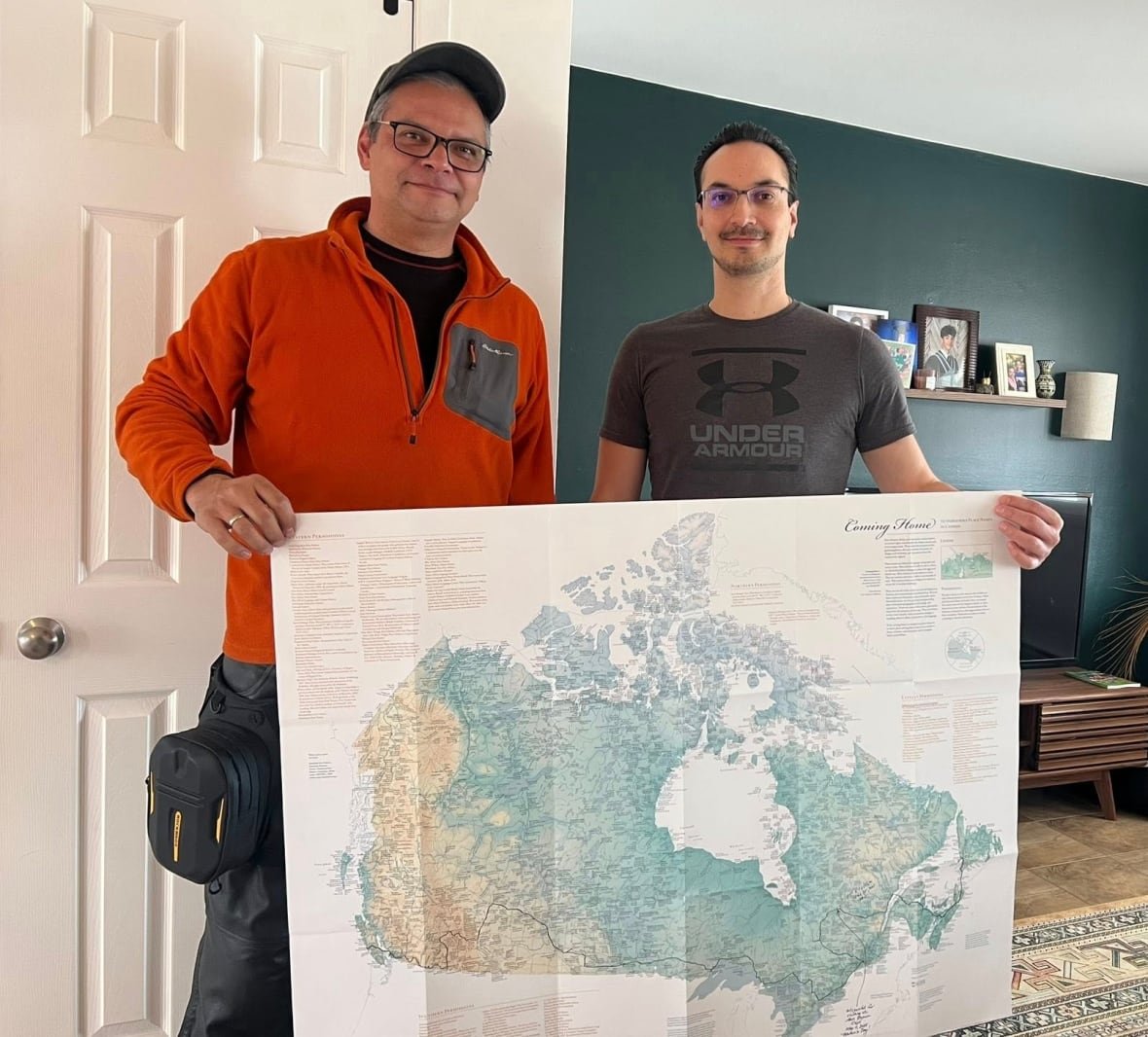 paul-john-murdoch-with-map two men hold a map of Canada