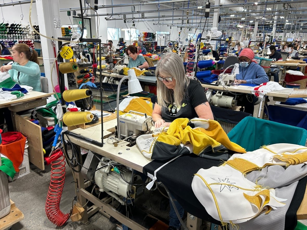 sewing Workers in a factory make hockey jerseys