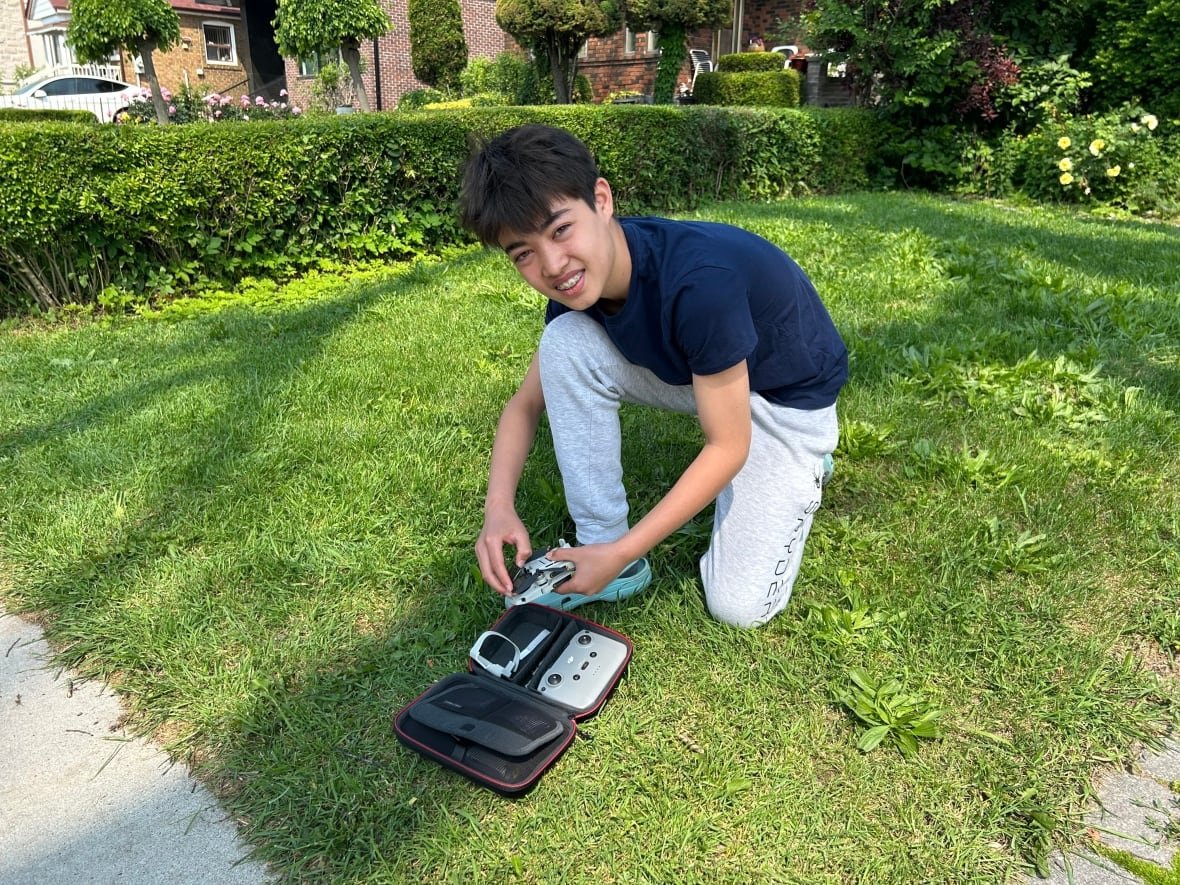 tree-ethan Ethan Tantram, 13, readies his drone to explore the old elm's upper reaches. Ethan says the tree has been a neighbourhood landmark for his entire life.