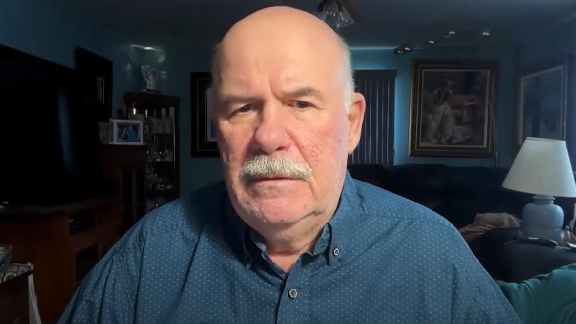 bob-kuylen Man in his 60s with white hair and white mustache wearing a blue button-up shirt.