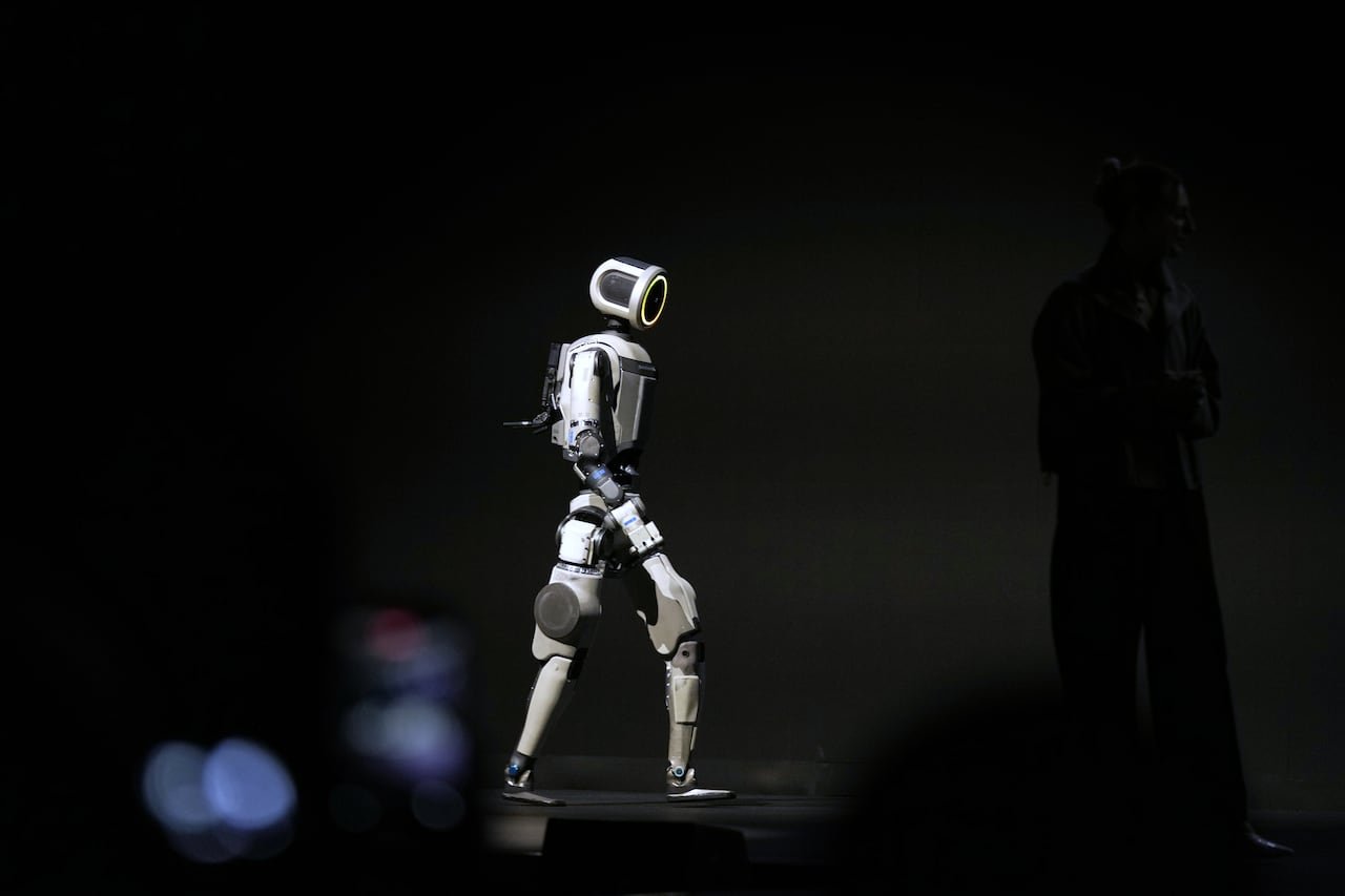 A robot walking on a stage.