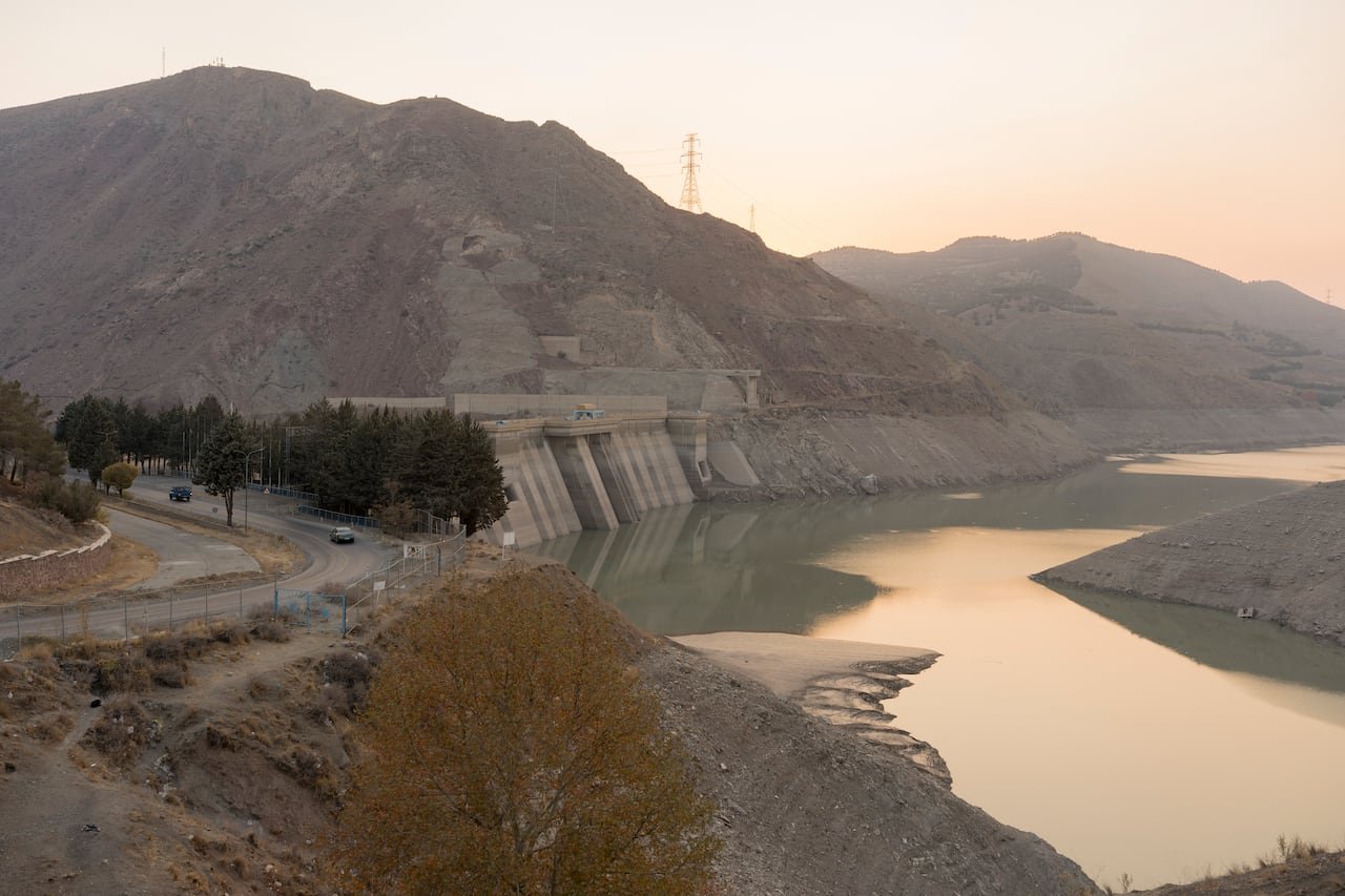 The exposed shoreline of Latyan Dam shows significantly low water levels near Tehran, Iran, on November 10, 2025. The reservoir, which supplies part of the capital's drinking water, has seen a sharp decline due to prolonged drought and rising demand