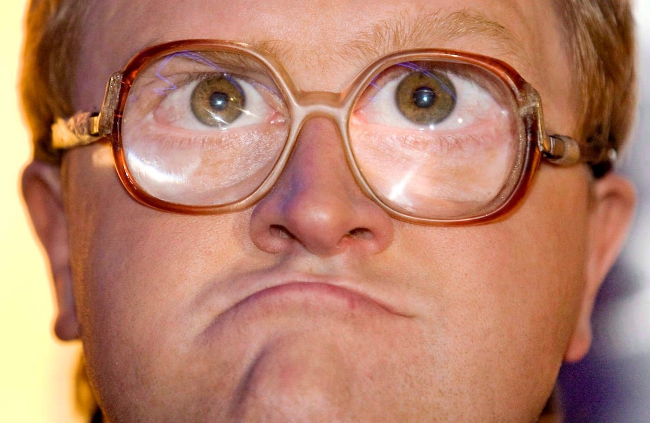 default-439 A close-up photo of a man wearing thick glasses.